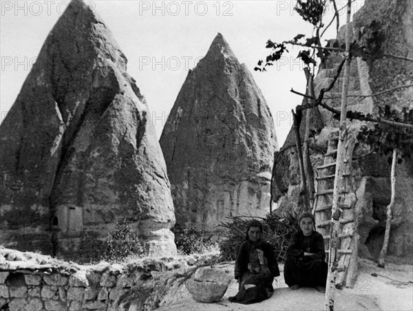 Turkey. cappadocia. two women in front of their homes. 1954