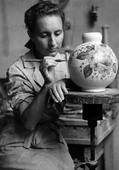 Italy. Marche. decorator. ceramics workshop. 1955