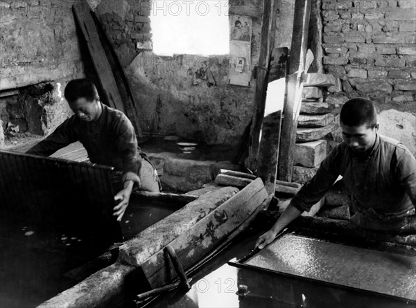 Paper Recycling. Processing Of The Mass Of Paper Dissolved In A Tub. China 1940-50