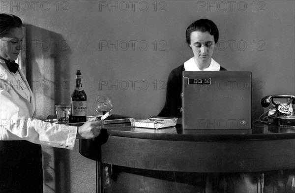 Waitress And Cashier At A Hotel Bar