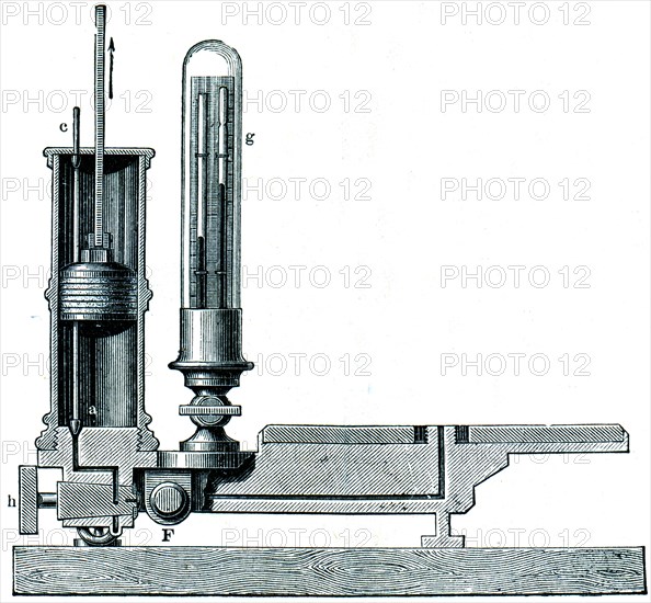 Section of an air pump with two cylinders and valves.