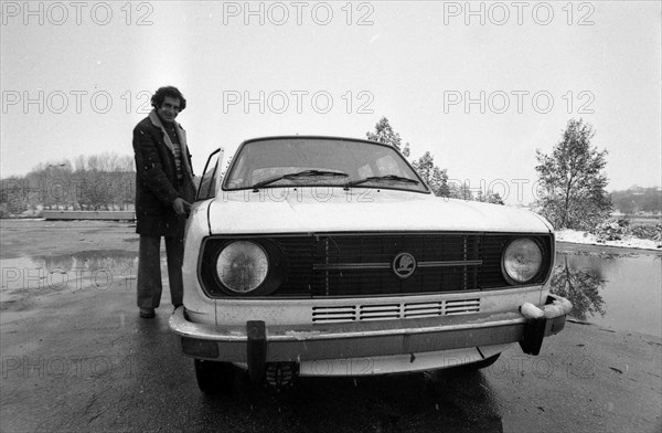 Young man demonstrates just bought him a car Skoda.