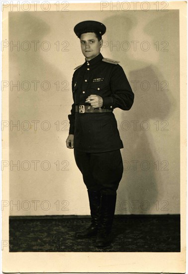 Lieutenant Soviet Army with a cigarette in his hand.