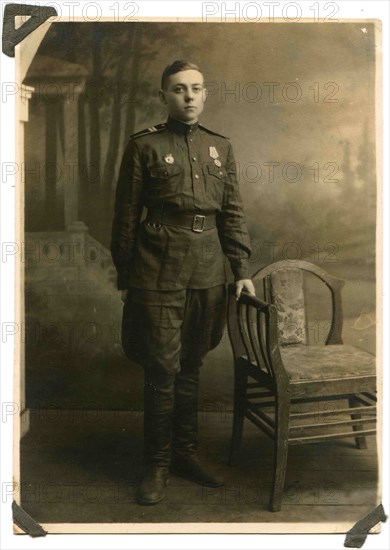 Soviet Army sergeant with a medal For the Victory in Great Patriotic War and the sign Guard on his chest.