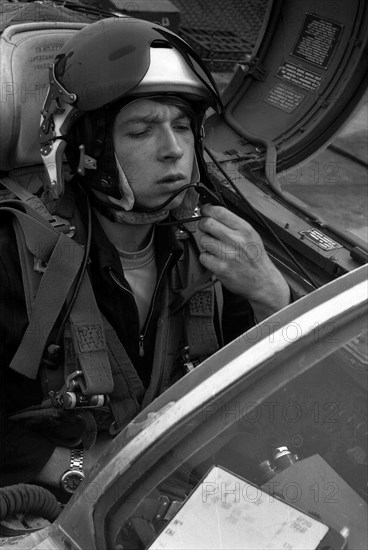 Pilot Lieutenant Valerii Poltoranin, testing avionics in the cockpit MiG-21.
