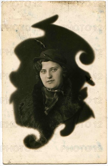 A young woman in a hat.