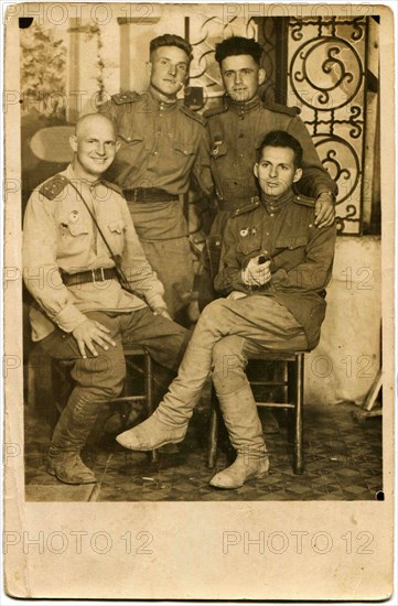 Four smiling officers of the Red Army.