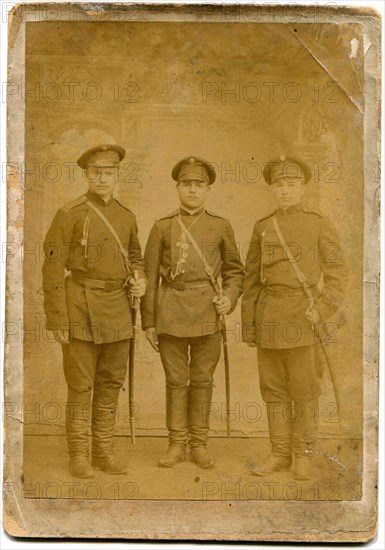 Three soldiers with swords.