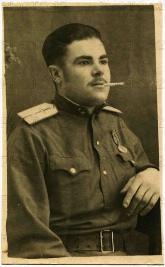 Air Force lieutenant with a cigarette in his mouth.