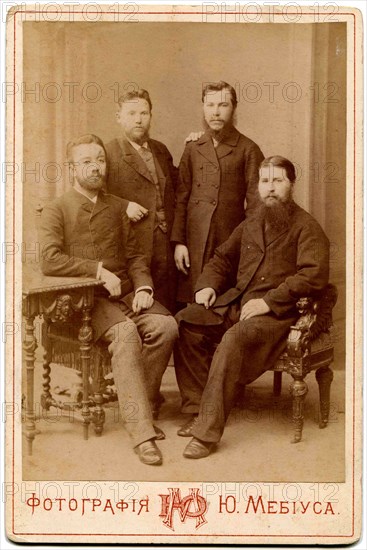 Four of the clergy in secular clothes.