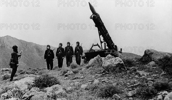 Military instruction, loading a rocket.