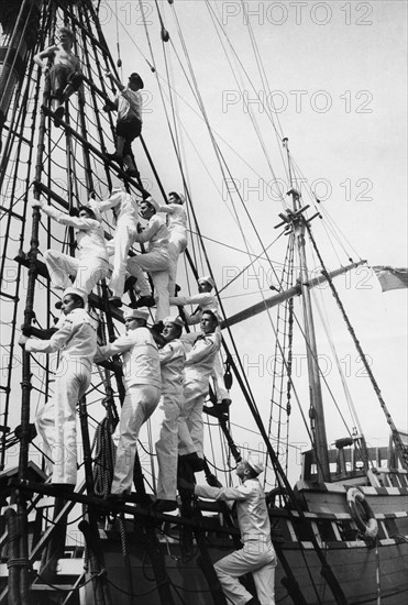 Cutty sark's godfrey wicksteed tops with guitarist graham nunn during sailors rope instruction.