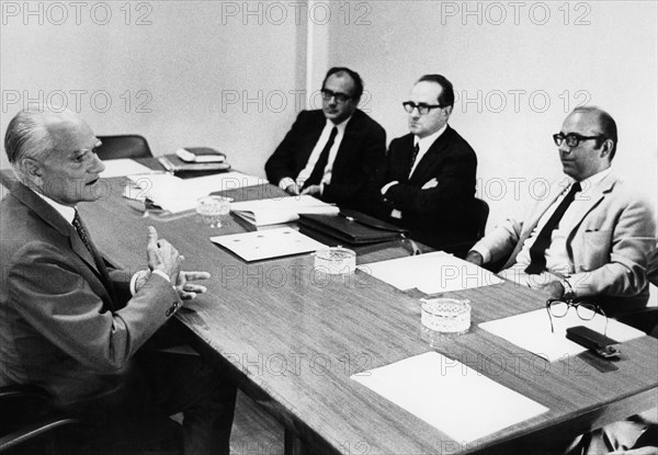 The writer alberto moravia in the journalism exam, in the commission the journalists gino palletta, vittorio di giacomo and prof colasanti.