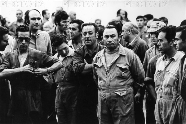 Workers On Strike Gathered Outside The Factory.