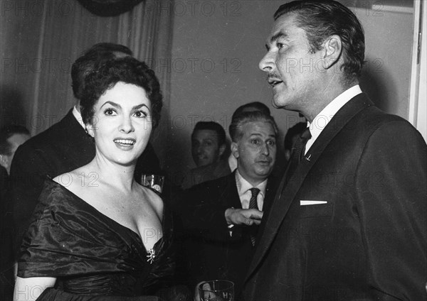 Gina Lollobrigida and Errol Flynn.