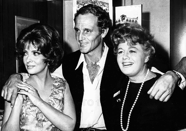 Gina Lollobrigida, Shelley Winters and Peter Lawford.