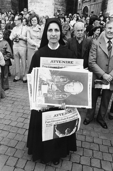 Vatican City, a nun with newspapers announcing the pontificate of John Paul II