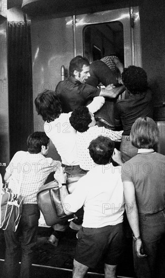 Italy, Milan, central station, assault on trains during the summer exodus, 70s