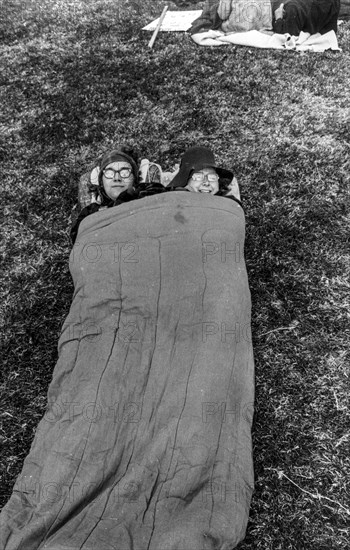 Couple in a sleeping bag in central park, new york, usa