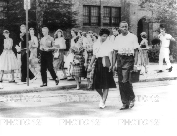 Young black people attending a school with caucasian young people, 60's