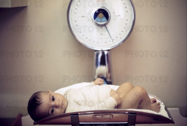 Newborn on a balance, 70's