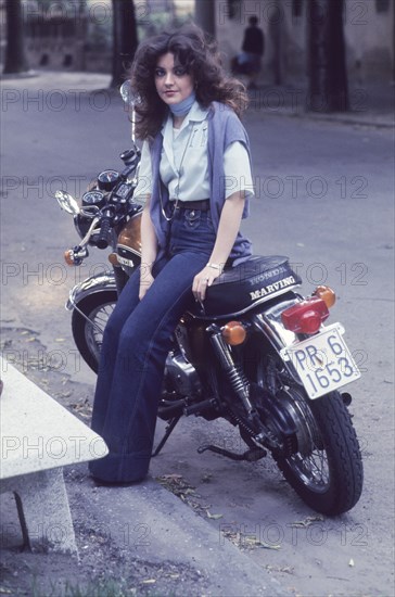 Young woman on motorbyke, 70's