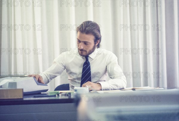 Man in office, 80's