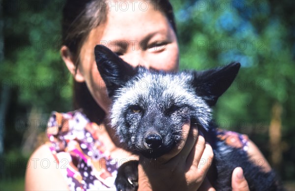 Ussr, siberia, jakutsk,  jakutian girl with a fox