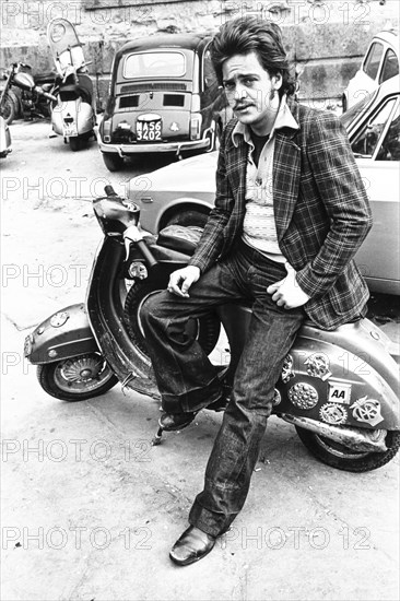 Man sitting on a vespa, naples, 70's