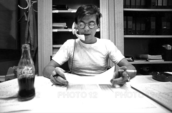 Man collecting data by phone, naples, italy, 70's