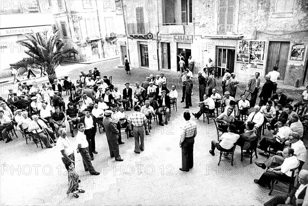 People in mazarino square, sicily, 1976