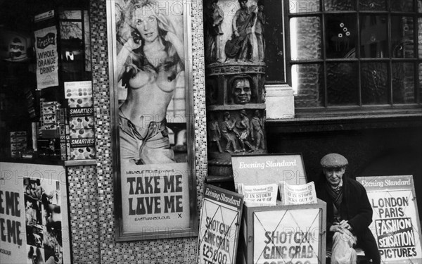 Uk, london, street vendor of evening standard newspaper, 70's