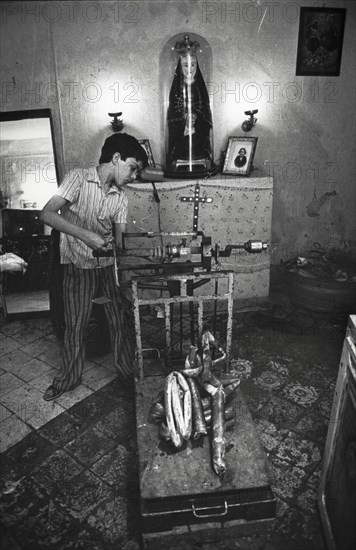 Little boy weighting metal, juvenile work, 80's