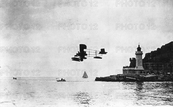 Seaplane Mario Calderara flying in La Spezia near the port, 1912