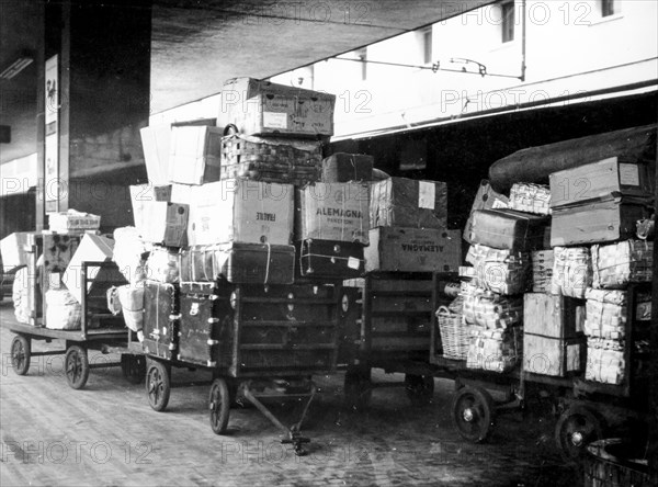 Luggage onto carts blocked by a strike, Rome, Italy, 1960
