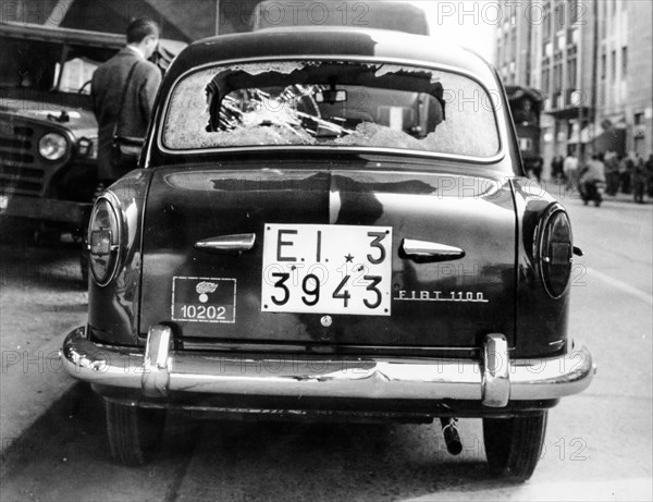 Car of the police destroyed by protesters, Rome, 1966