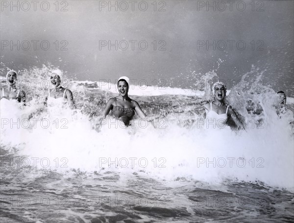 Girls playing with waves, miami, usa, 1959