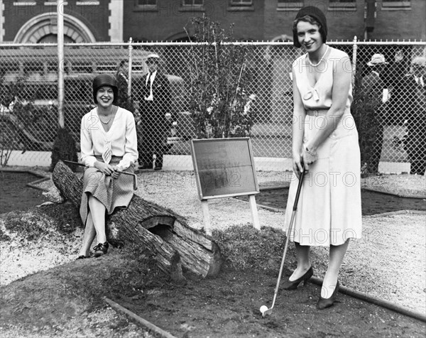 Women Playing Miniature Golf