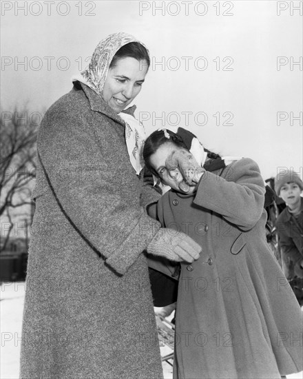 Girl Comforted By Mother