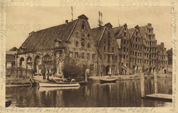 Old granaries at the river Trave, Lübeck, Schleswig-Holstein, Germany, view from c. 1910, digital reproduction of a public domain postcard.