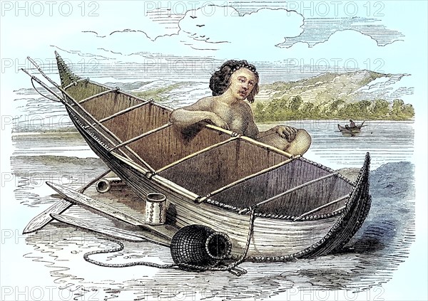 Woman with a canoe on Tierra del Fuego