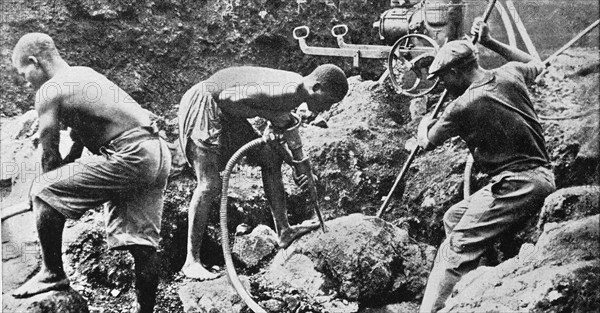 Native workers from Cameroon with modern tools