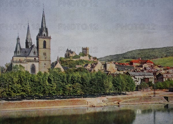 The Nahe riverbank in Bingen with the parish church and Klopp Castle in 1910, Rhineland-Palatinate, Germany, photograph, digitally restored reproduction of an original artwork from the early 20th century, exact original date unknown.