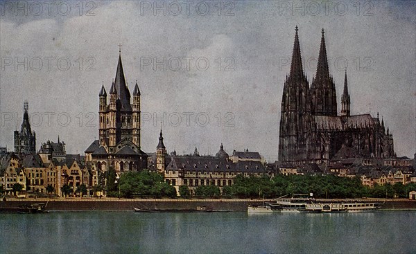 Cologne Cathedral with Saint Martin and Town Hall Tower in 1910, North Rhine-Westphalia, Germany, photograph, digitally restored reproduction of an original artwork from the early 20th century, exact original date unknown.