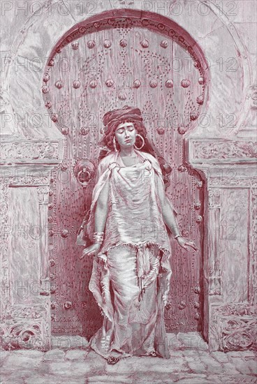 Woman From Morocco In Front Of A Wooden Door