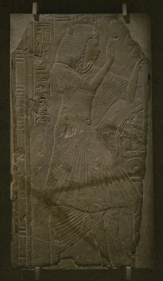 Low-relief of the priest Ameneminet making an offering to the gods.