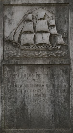 Commemorative stone slab with heraldic coat of arms of the city of Lisbon.