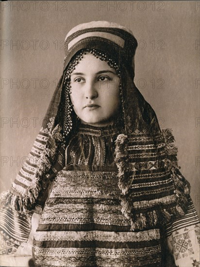 Young woman in cultural dress in South Russia