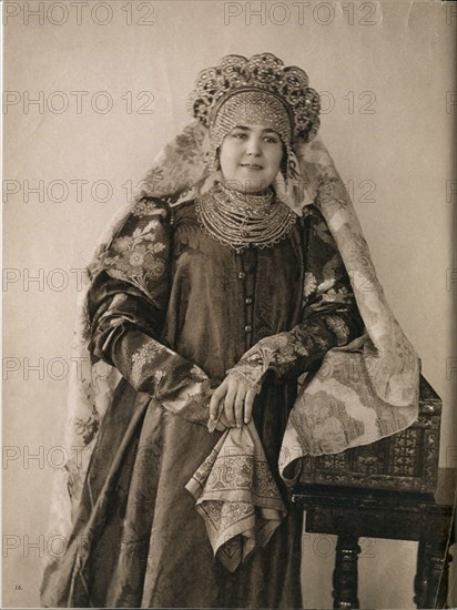 Young Russian woman in traditional cultural dress from Northern Russia