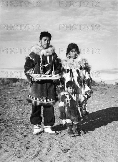 Eskimo Family With Model Ship